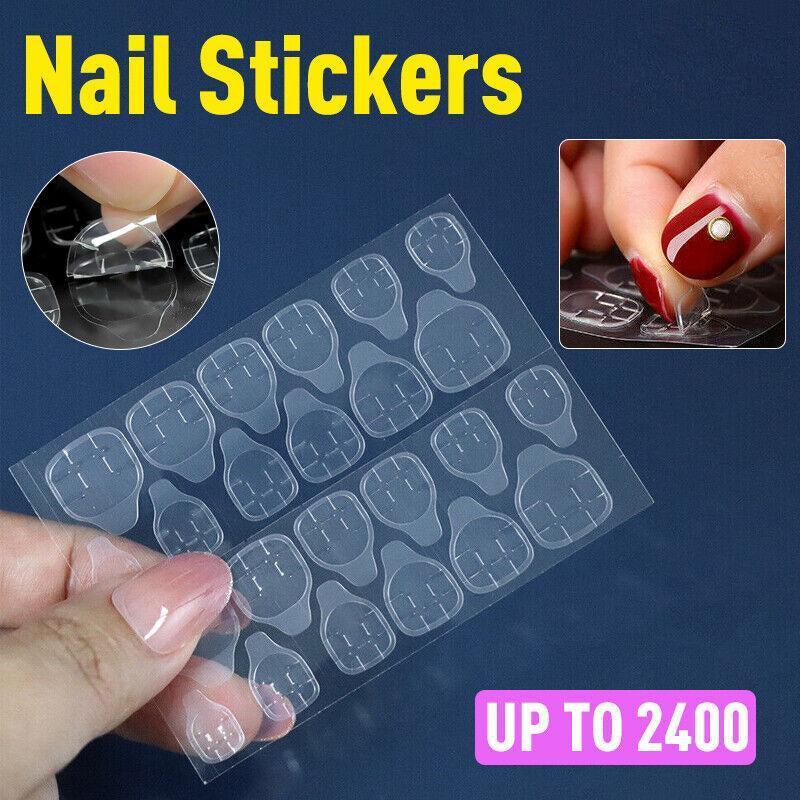 Clear double-sided adhesive press on nail stickers on a transparent plastic backing sheet.