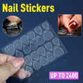 Clear double-sided adhesive press on nail stickers on a transparent plastic backing sheet.