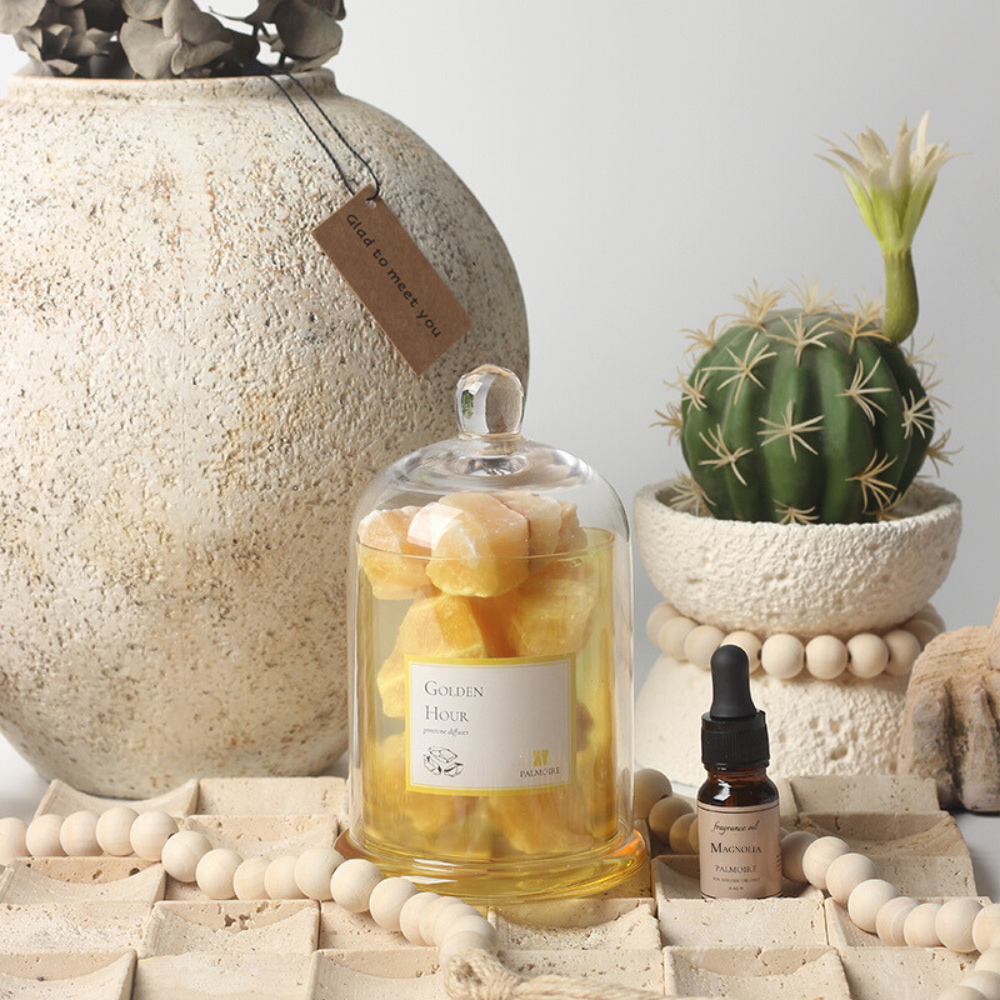 Golden hour gemstone diffuser with elegant decorative stones and luxury magnolia fragrance oil bottle — view 2