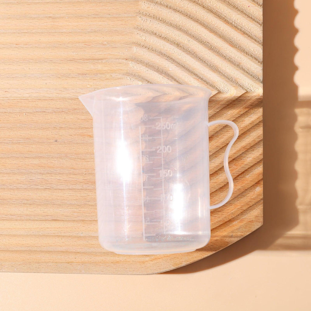 Clear 300ml measuring cup with graduation marks for precise kitchen baking and crafting