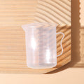 Clear 300ml measuring cup with graduation marks for precise kitchen baking and crafting