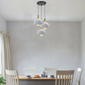 Three head modern white and gold metal dome pendant light hanging from a ceiling plate