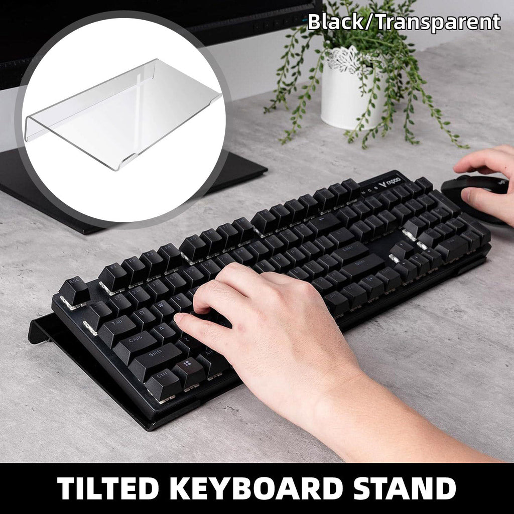 Transparent tilted acrylic keyboard stand supporting a compact black mechanical keyboard on a desk — view 4