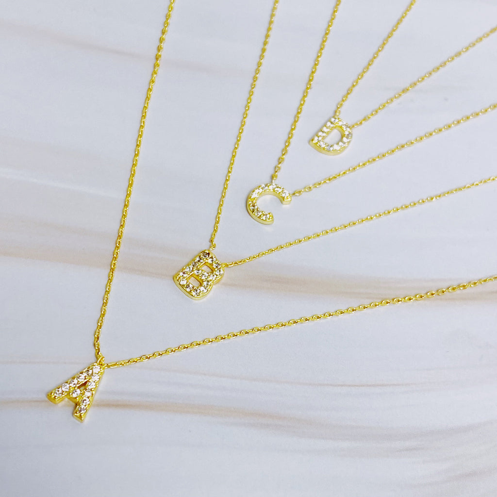 18k gold plated initial necklace with cubic zirconia stones on a delicate chain — view 2