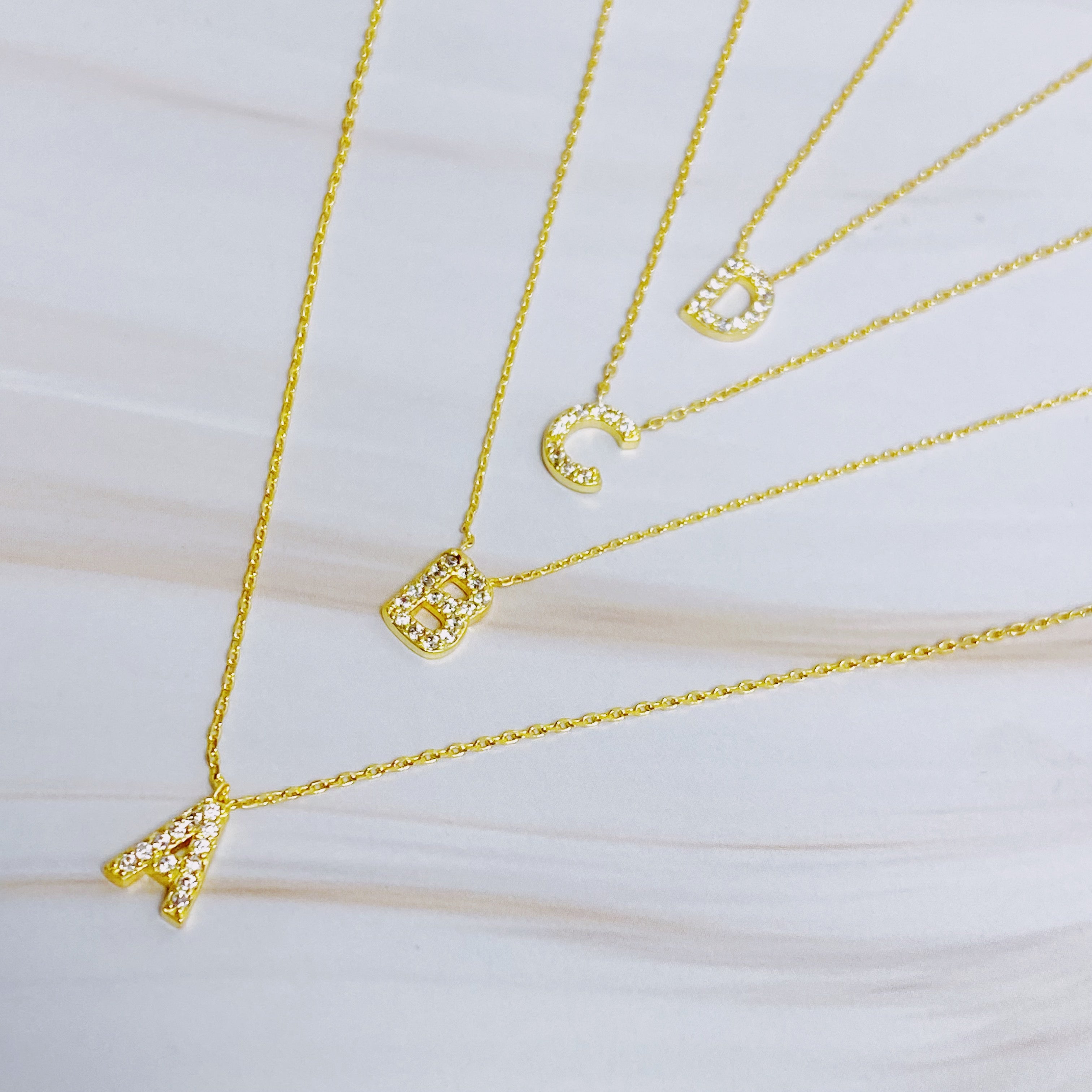 18k gold plated initial necklace with cubic zirconia stones on a delicate chain — view 2