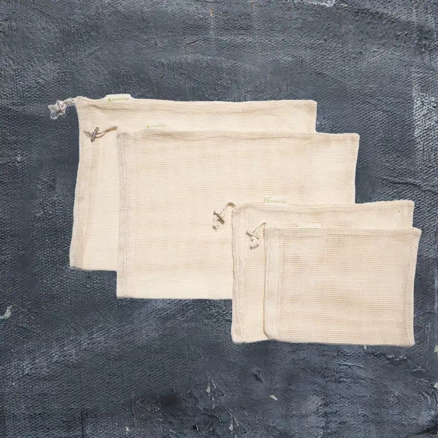 Set of four natural organic cotton mesh produce bags with drawstring closures