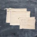 Set of four natural organic cotton mesh produce bags with drawstring closures