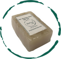 Round all-natural oat and lavender pet shampoo bar for dogs and cats