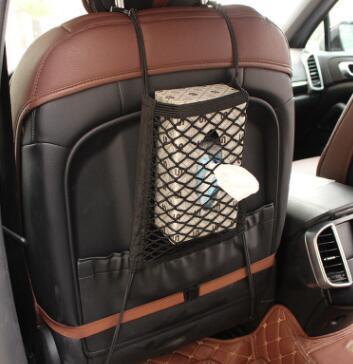 Black polyester universal car seat storage net and pet barrier suspended between two front seats — view 4