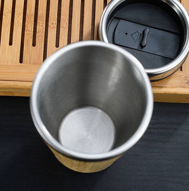 Leakproof bamboo travel mug with stainless steel interior and non-slip silicone base — view 2