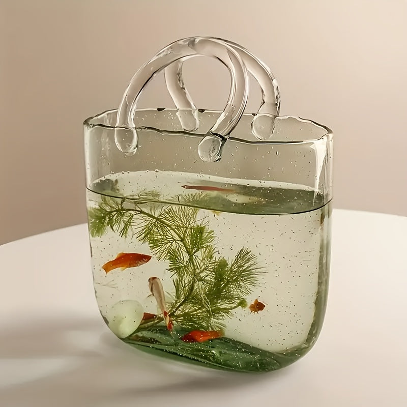 Clear transparent glass handbag vase doubling as a desktop fish tank and decorative hydroponic plant container — view 3