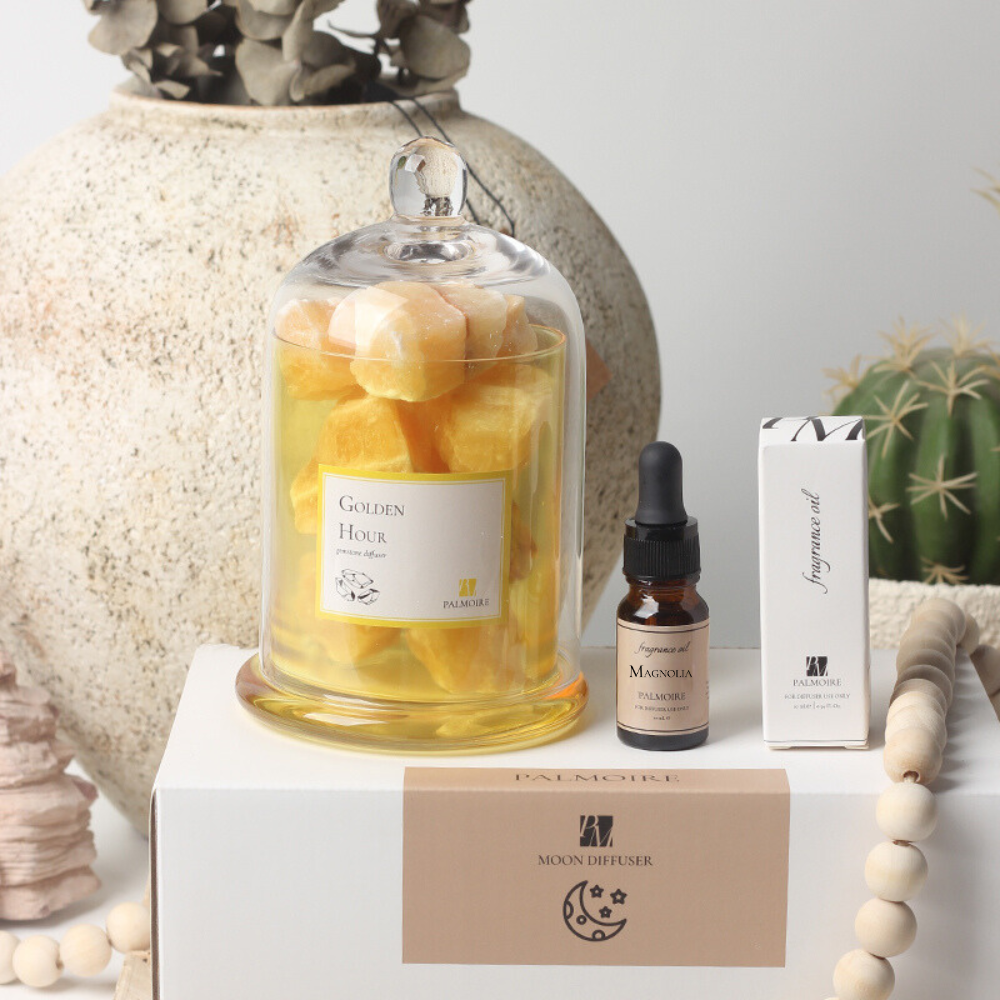Golden hour gemstone diffuser with elegant decorative stones and luxury magnolia fragrance oil bottle — view 3