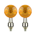 Chrome motorcycle turn signals with bright amber lens and silver housing for custom bike builds.