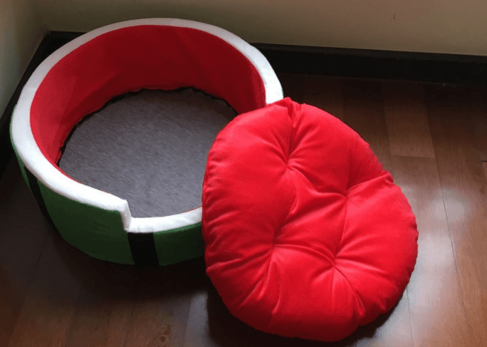 Juicy oasis pet bed in vibrant red and green watermelon design made of plush cotton — view 2