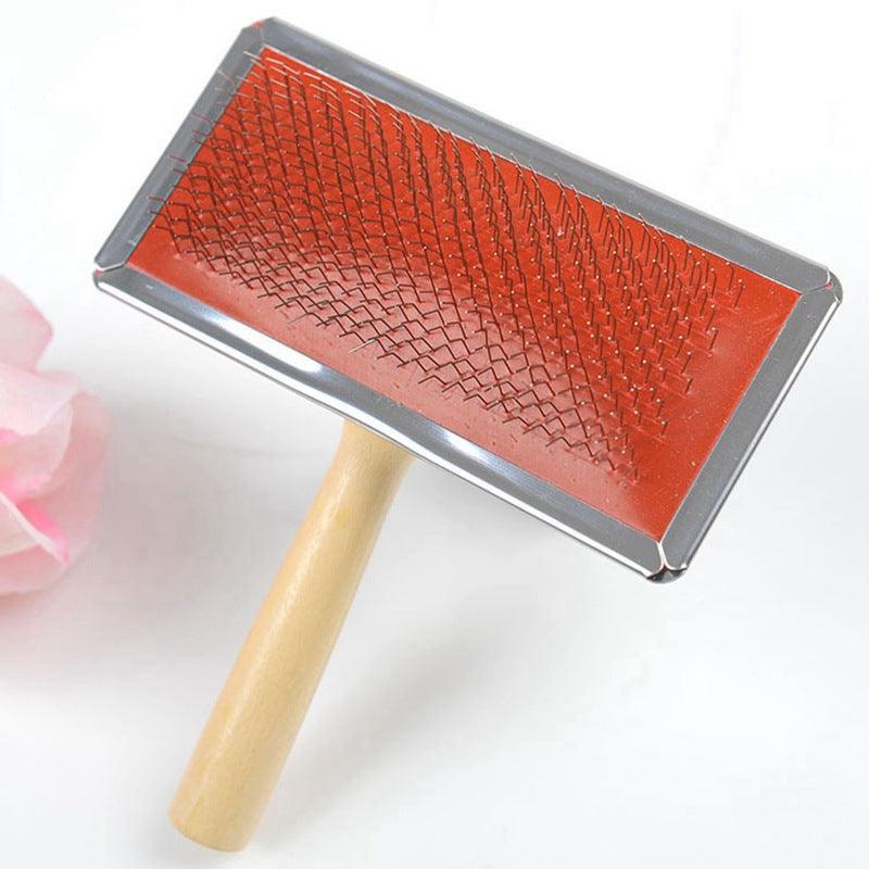 The Furbuster Pro dog grooming comb with wooden handle and stainless steel needle pins — view 3