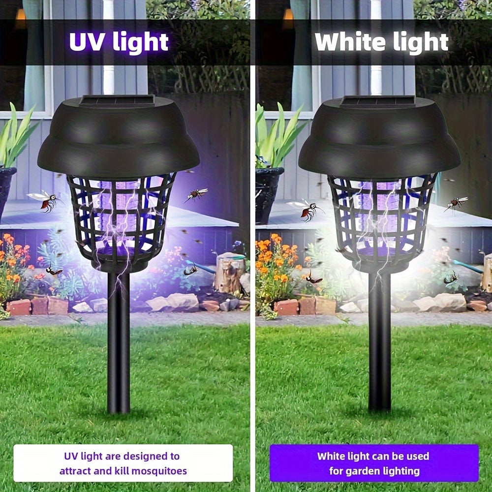 Four outdoor solar powered UV mosquito repellent lamps staked into green grass — view 5