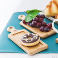Natural bamboo rectangular appetizer serving tray with an integrated handle for entertaining