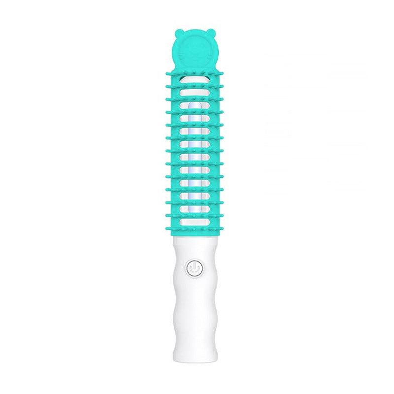 Ozone pet grooming brush in colorful plastic with ergonomic handle for shedding and odor control — view 3