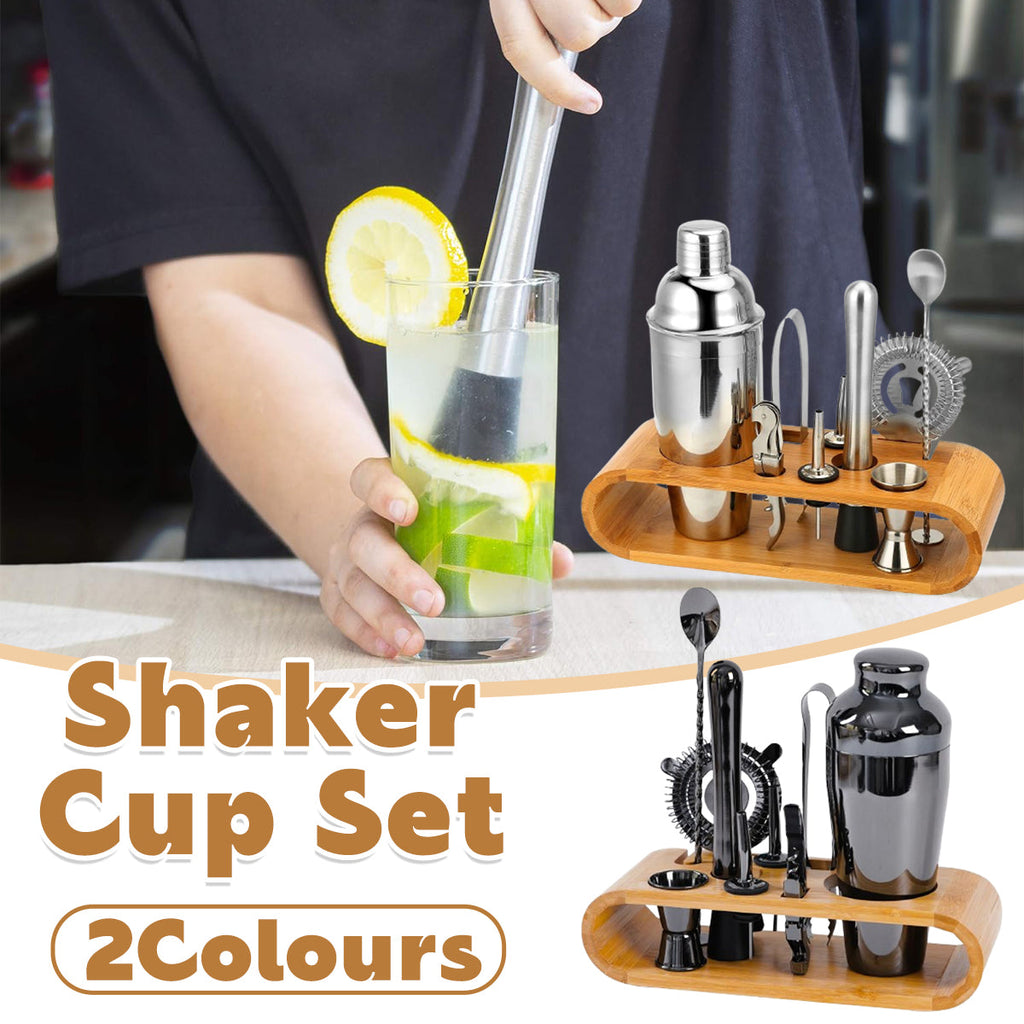 Stainless steel cocktail shaker set with mixing tools organized on a wooden bamboo display stand
