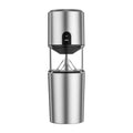 Compact portable electric coffee grinder featuring ceramic burrs and a sleek ergonomic body for travel use.