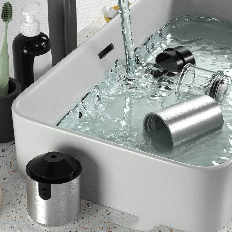 Compact portable electric coffee grinder featuring ceramic burrs and a sleek ergonomic body for travel use. — view 3
