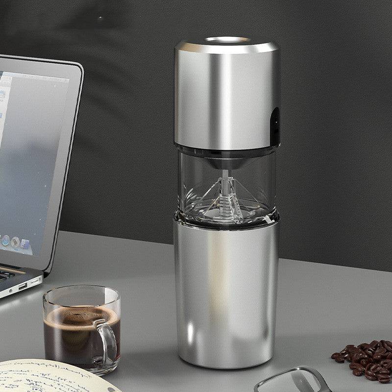 Compact portable electric coffee grinder featuring ceramic burrs and a sleek ergonomic body for travel use. — view 4