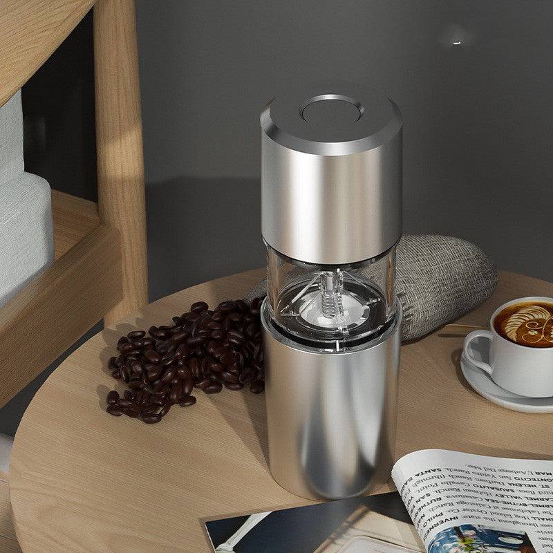Compact portable electric coffee grinder featuring ceramic burrs and a sleek ergonomic body for travel use. — view 5
