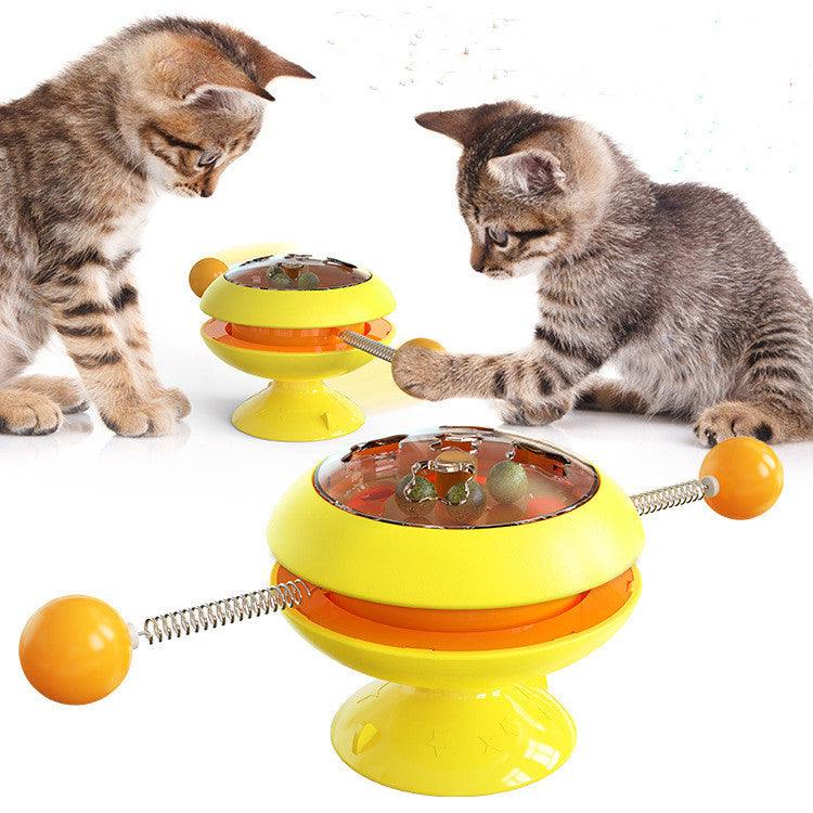 Interactive rotatable plastic cat toy with built in catnip balls and large suction cup base