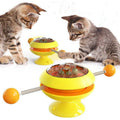Interactive rotatable plastic cat toy with built in catnip balls and large suction cup base