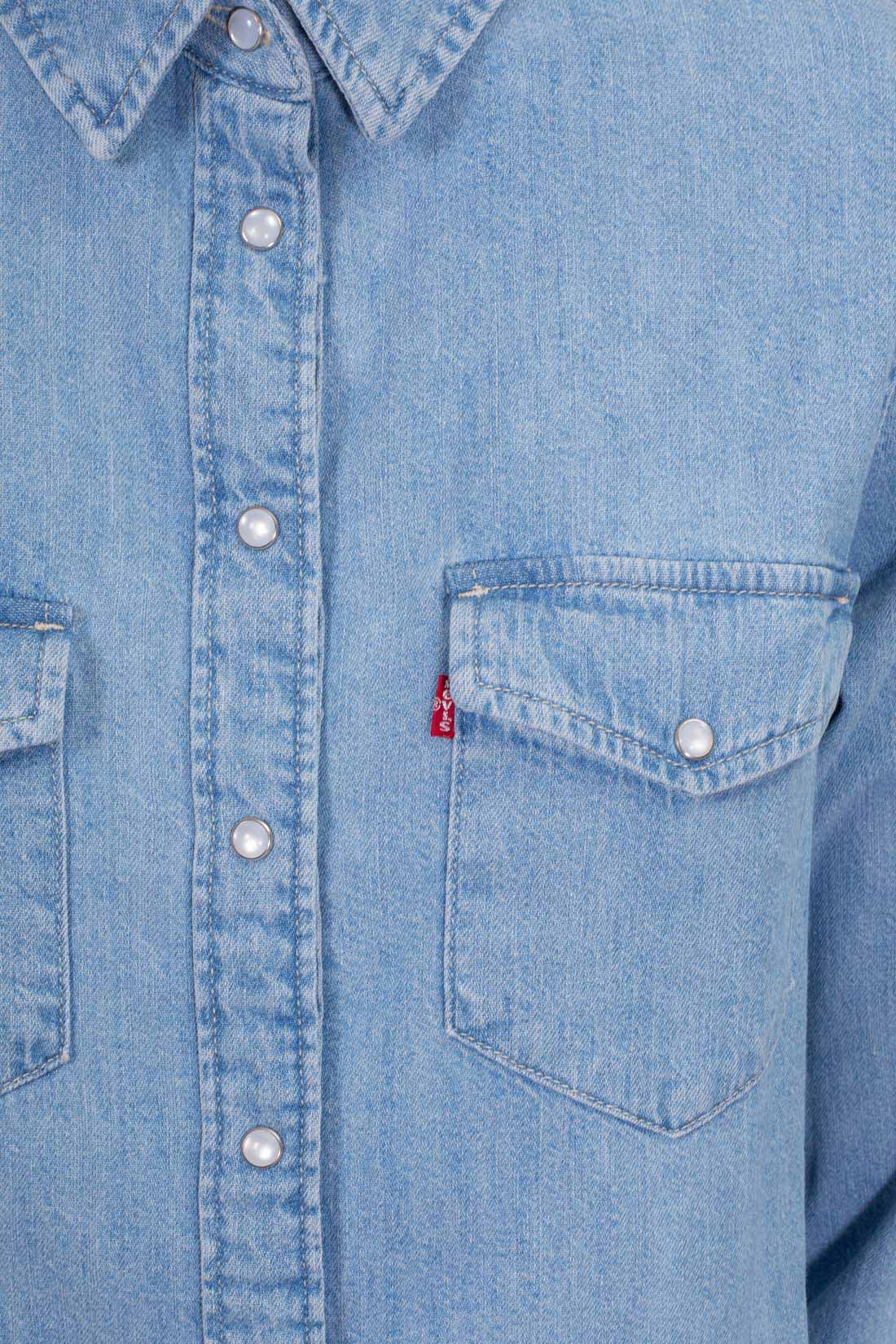 Women's light blue wash denim shirt with snap buttons, long sleeves, and front flap pockets. — view 5