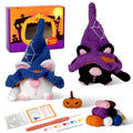 Halloween cat gnome amigurumi crochet kit with wizard hat, pumpkin, and crafting materials on display