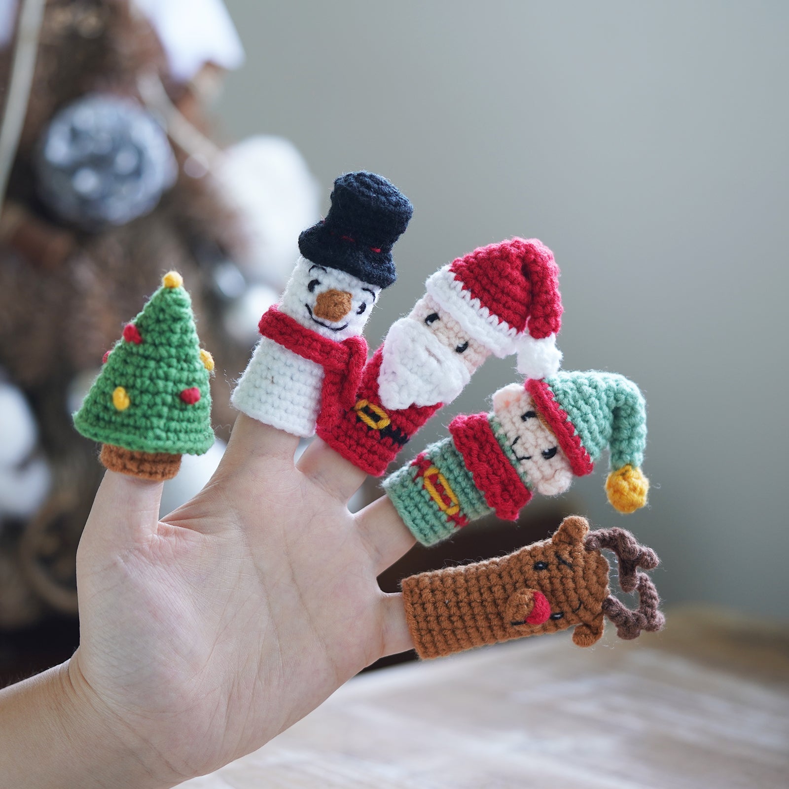 Christmas amigurumi crochet kit with yarn hook needle and finished miniature Santa and snowman figures — view 3