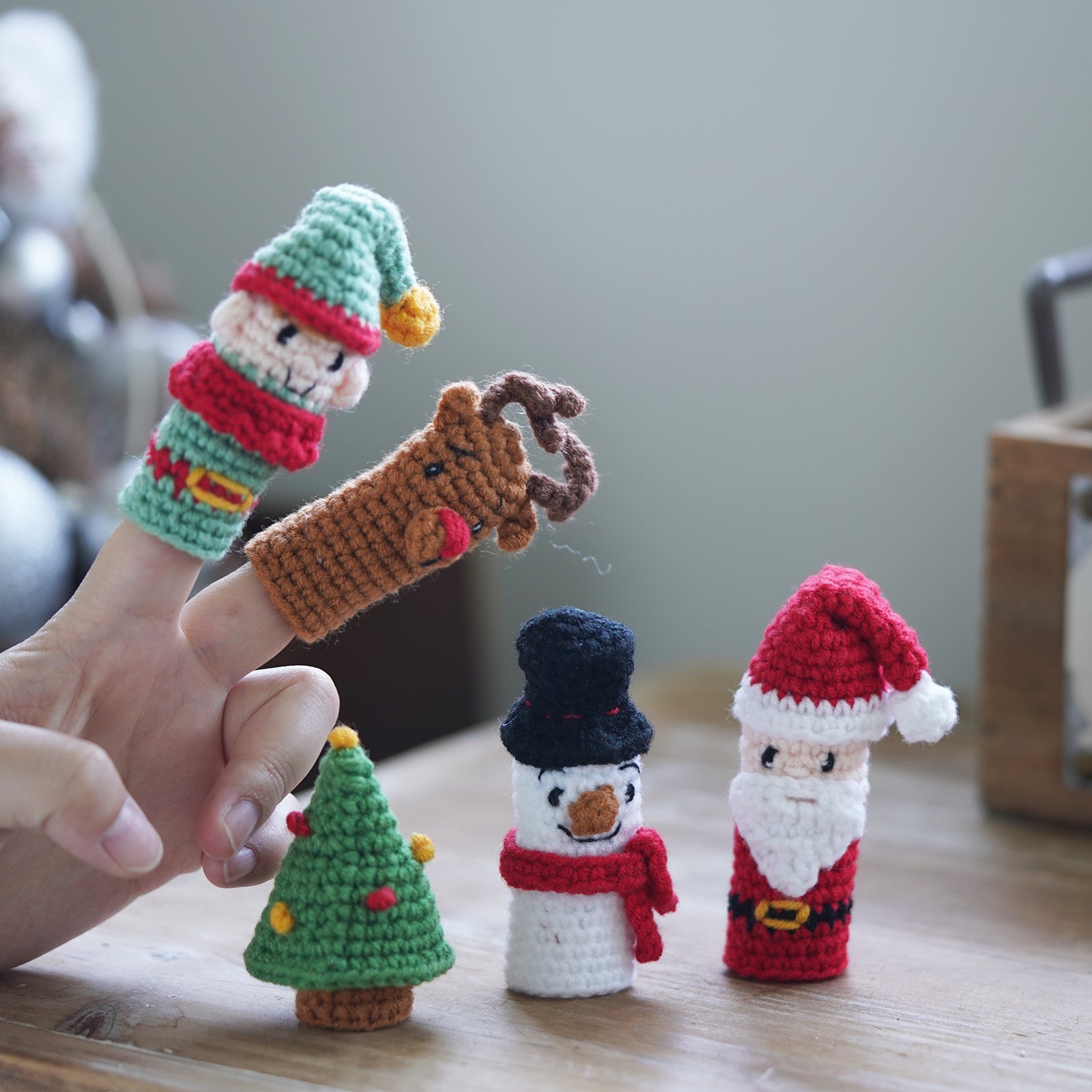 Christmas amigurumi crochet kit with yarn hook needle and finished miniature Santa and snowman figures — view 2