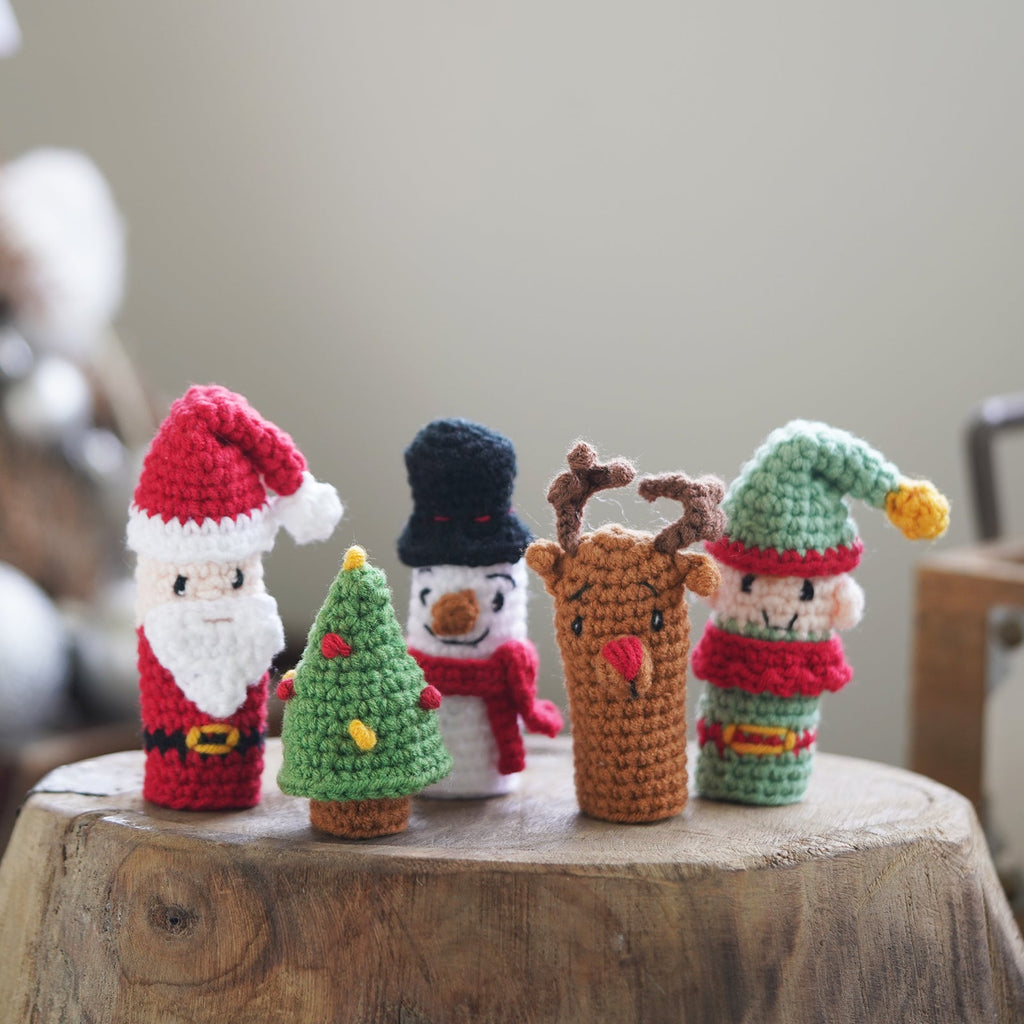 Christmas amigurumi crochet kit with yarn hook needle and finished miniature Santa and snowman figures — view 4