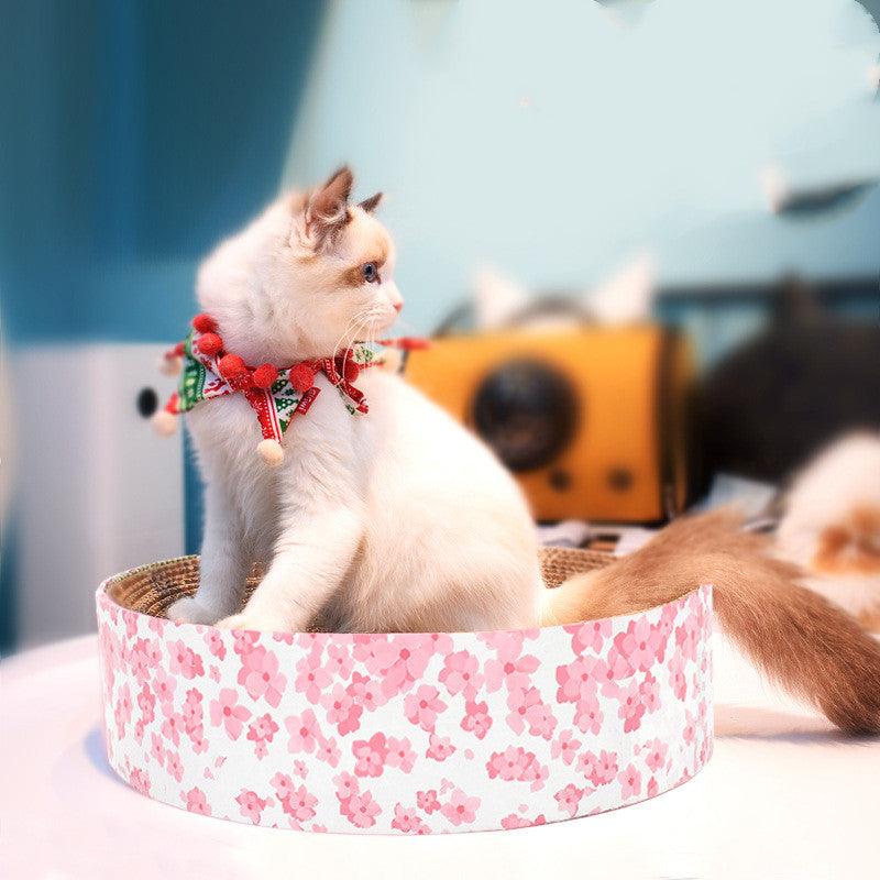 Round corrugated cat scratcher with wooden frame serving as a modern indoor pet lounge