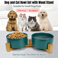 Double ceramic pet feeding bowls on an elevated wooden bamboo stand in stylish modern colors