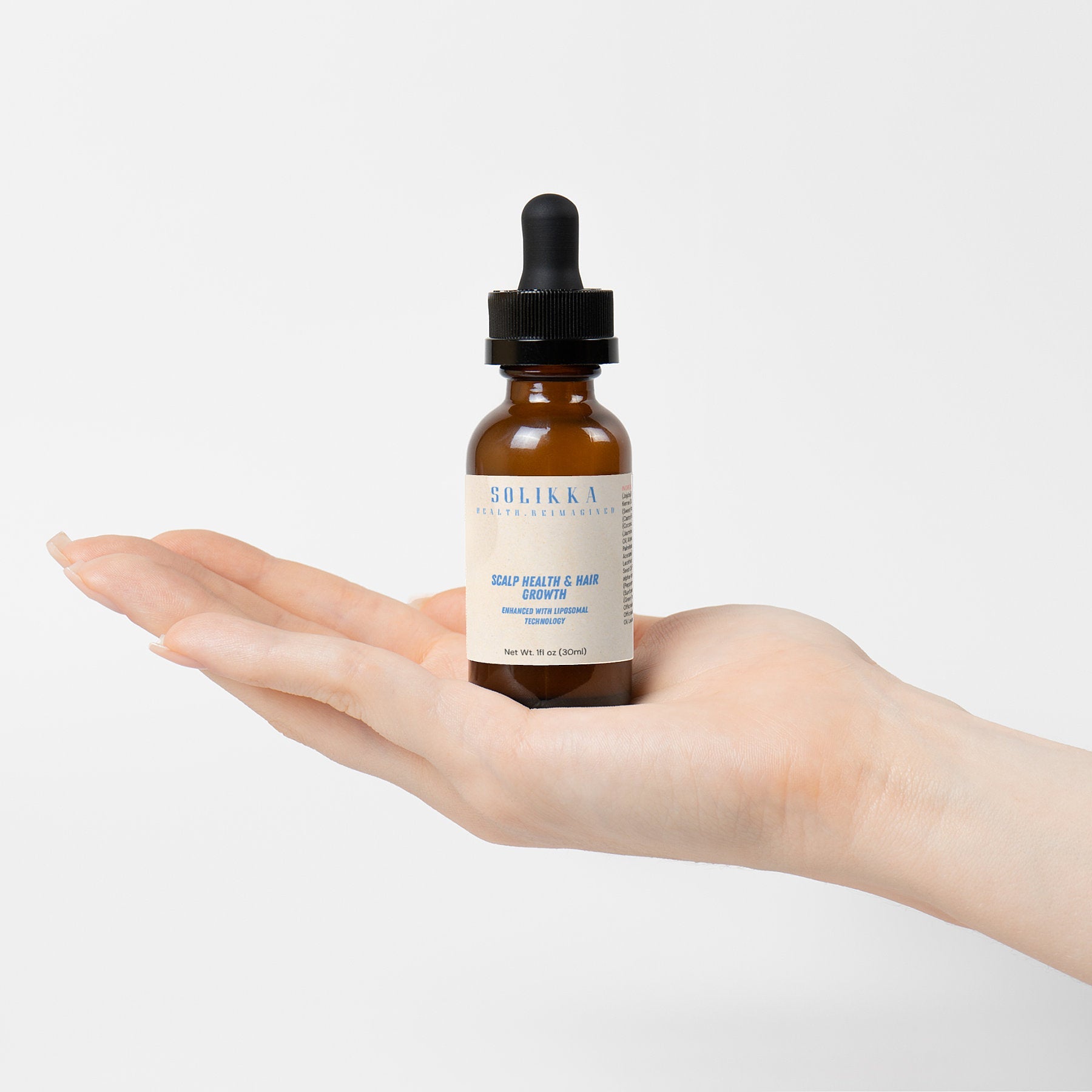 Hair oil for scalp health in one ounce dropper bottle with botanical ingredients — view 4