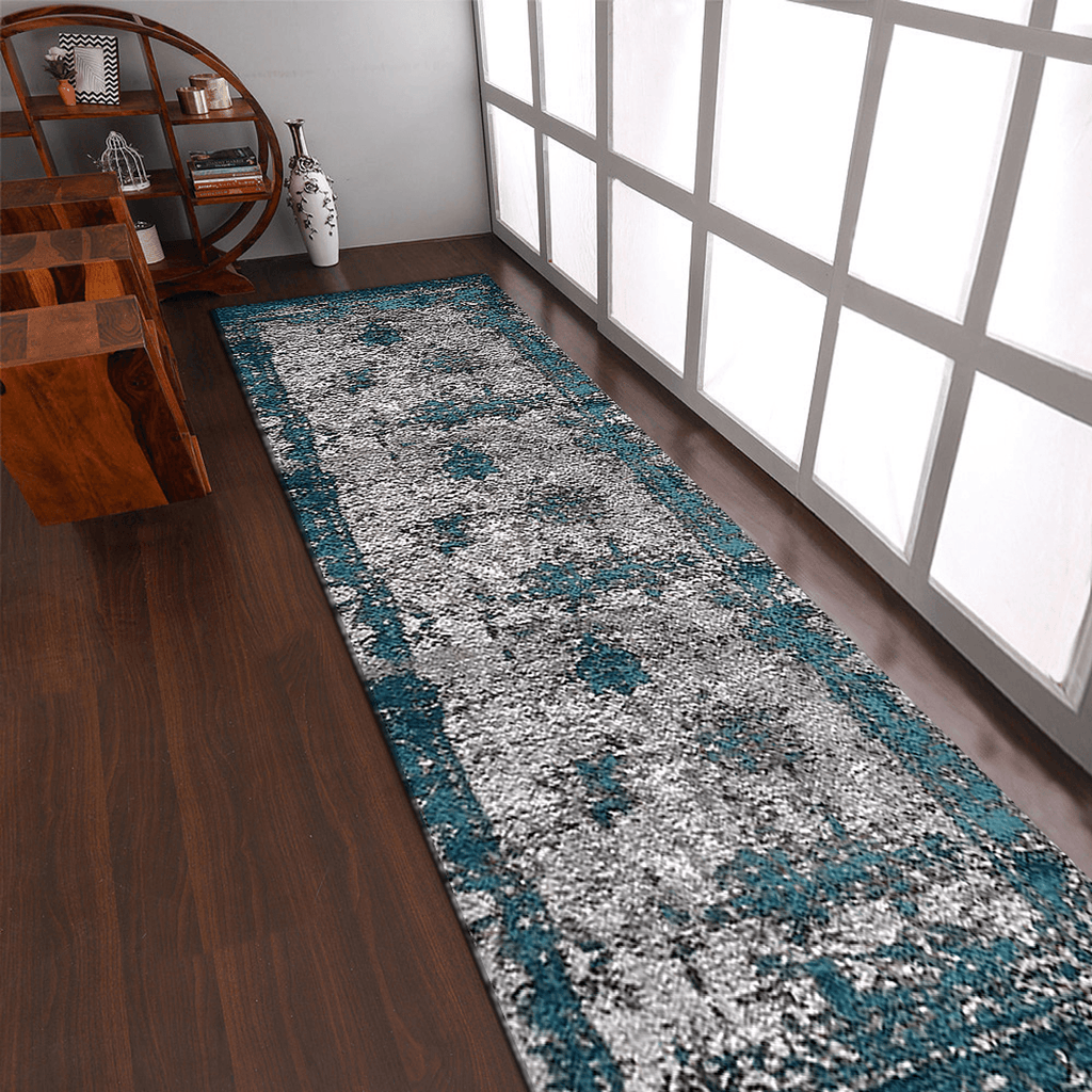 Abstract ivory and blue machine woven runner rug rolled out in a modern hallway setting — view 3