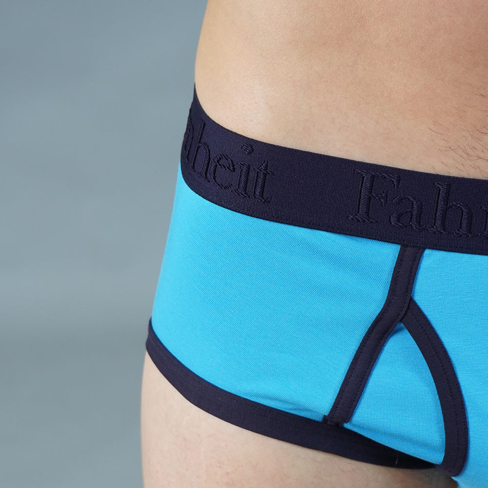 Solid blue men's brief underwear featuring a smooth elastic waistband and raised logo detailing — view 4