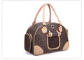 Luxury leather pet travel tote, stylish faux leather dog and cat carrier bag with sturdy handles.