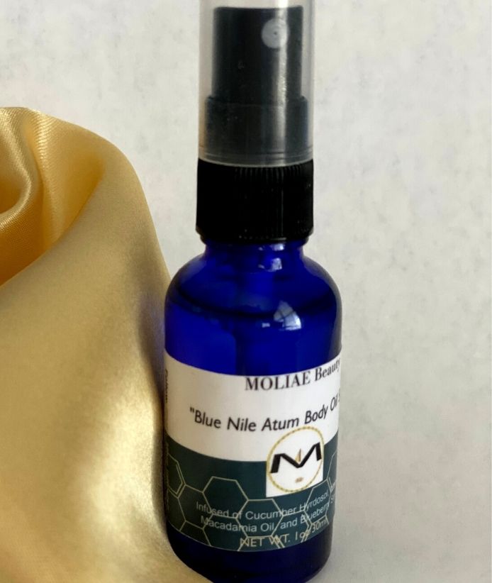 Blue Nile Atum body oil spray bottle with organic cucumber and blueberry seed oil extract — view 4