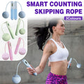 Smart cordless weighted jump rope with digital counter handles and attached pink resistance balls