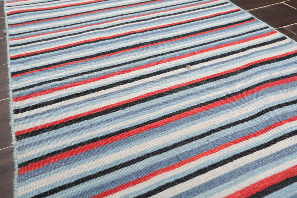 Traditional blue hand knotted wool oriental runner rug with terracotta and grey accents