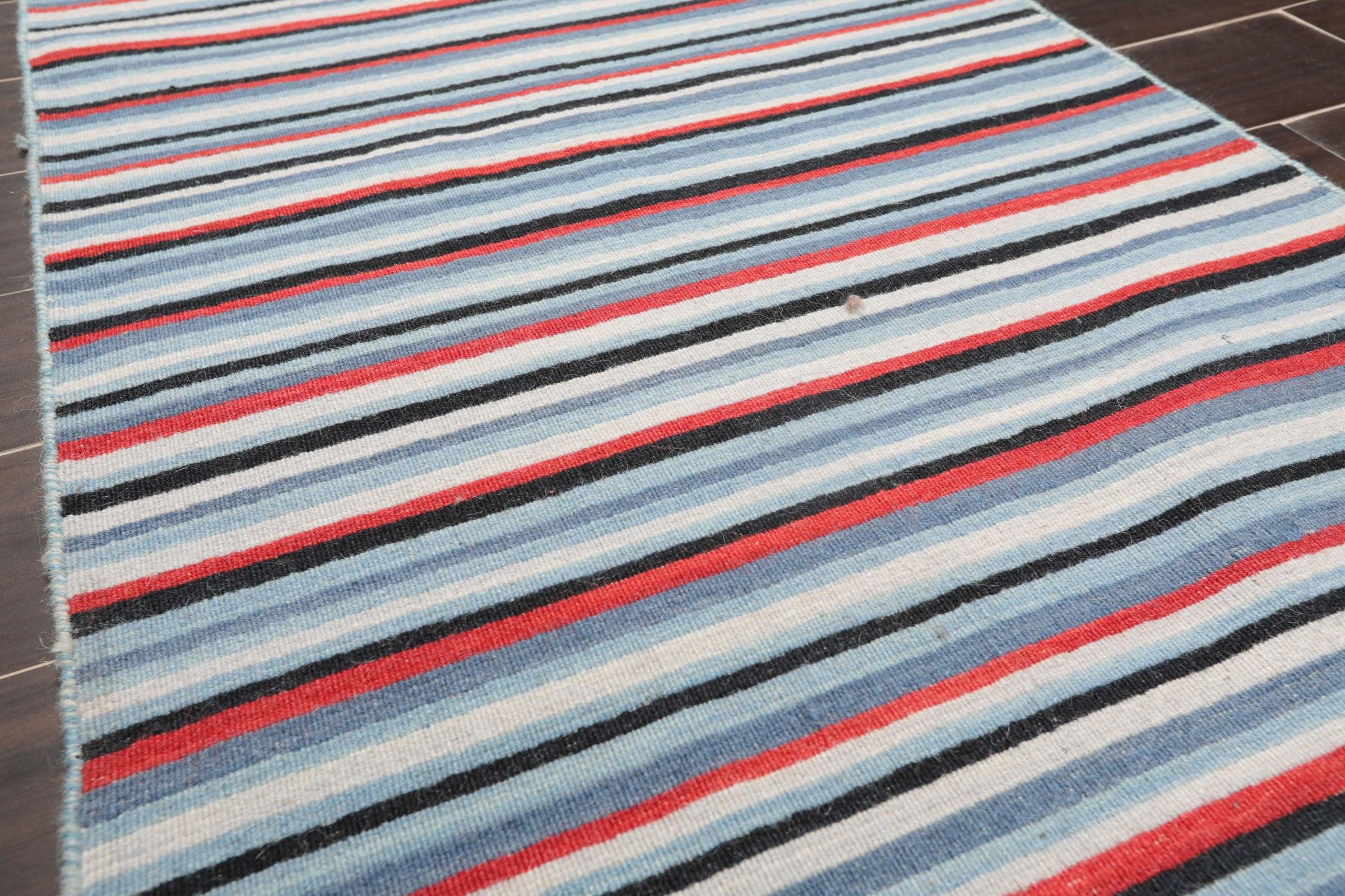 Traditional blue hand knotted wool oriental runner rug with terracotta and grey accents