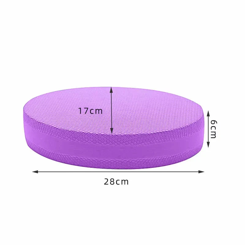 Purple oval non-slip yoga balance cushion mat made of soft foam for Pilates and stretching.