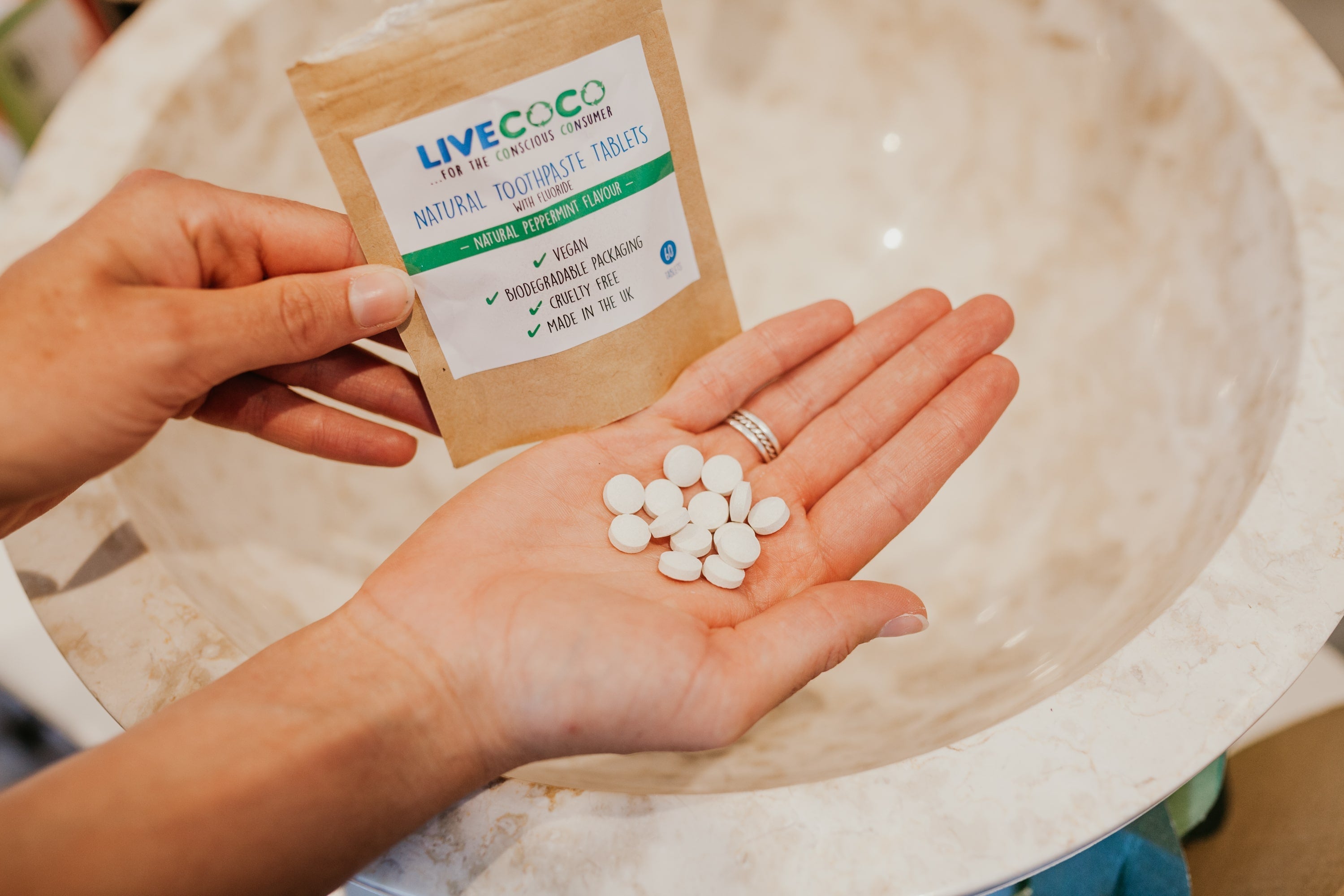 Fresh peppermint toothpaste tablets in a reusable tin container for zero waste oral care — view 5