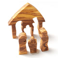 Olive wood nativity scene puzzle with carved figures of Mary, Joseph, and baby Jesus.