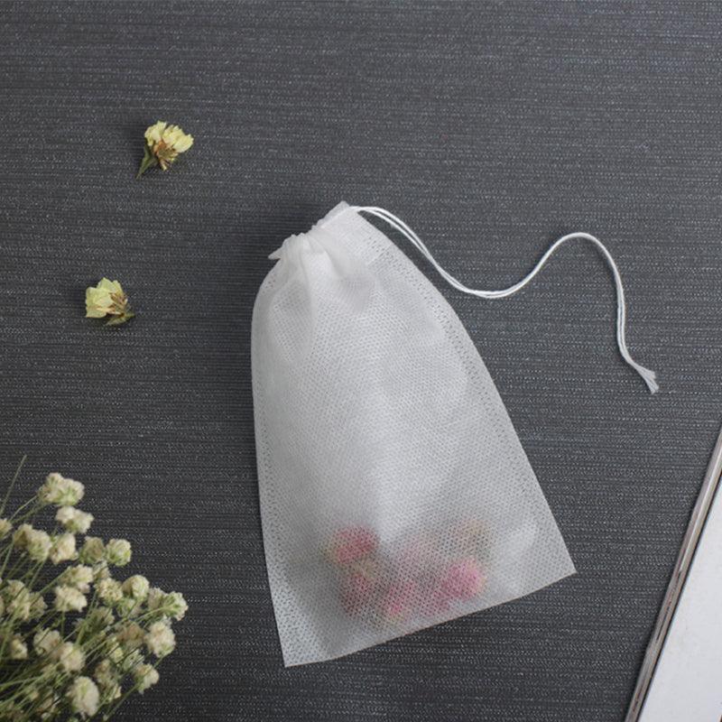 Set of 50 beige cotton muslin drawstring filter bags for tea, spices, and soup preparation. — view 3