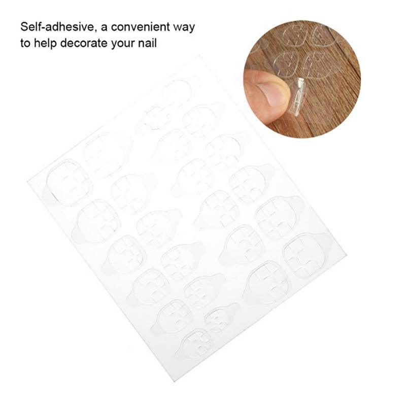 Clear double-sided adhesive press on nail stickers on a transparent plastic backing sheet. — view 3