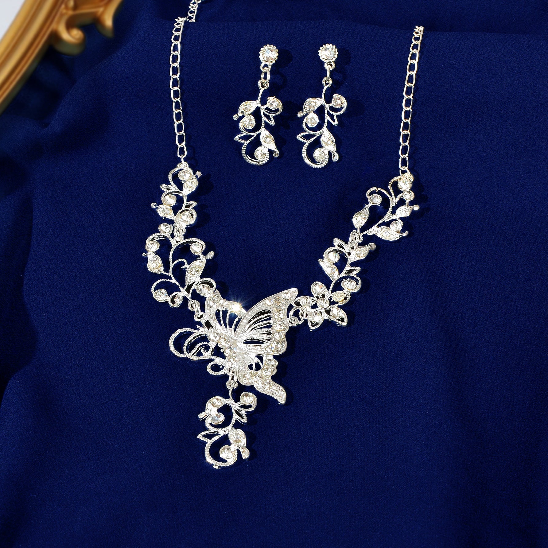 Silver-toned flower and butterfly collar necklace with matching drop earrings elegant anniversary jewelry set — view 3